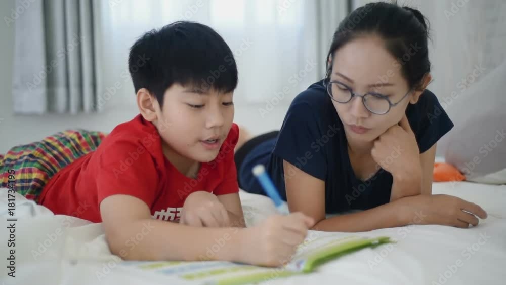 Old sister teach young brother read book. Old sister teach young brother read book.