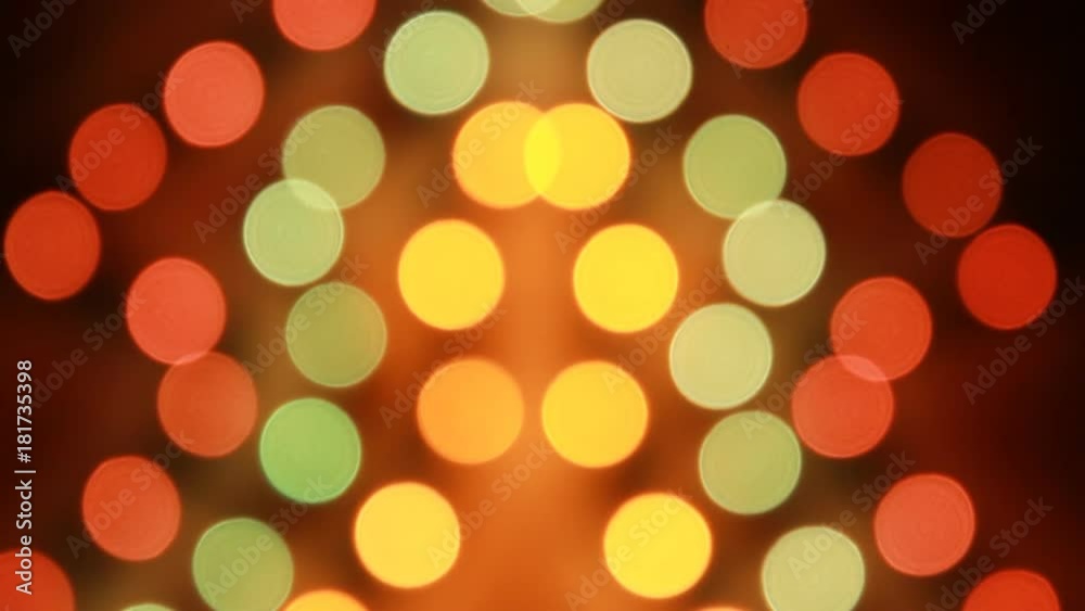 Abstract Blurred Christmas Lights Bokeh Multicolored. Black dark background. Blinking Christmas Tree. Twinkling. Winter Holidays Concept and New Year. Abstract Blurred Christmas Lights Bokeh Multicolored. Black dark background. Blinking Christmas Tree. Twinkling. Winter Holidays Concept and New Year.