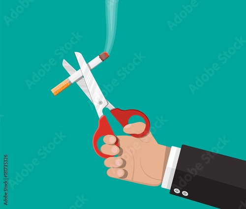 Scissors in hand cut a cigarettes.