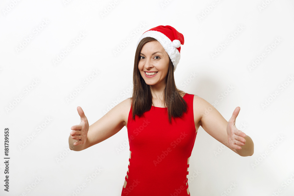 Pretty caucasian happy woman wearing red dress and Christmas hat holding copy space between palms for advertisement or text on white background. Santa girl isolated. New Year holiday 2018 concept Pretty caucasian happy woman wearing red dress and Christmas hat holding copy space between palms for advertisement or text on white background. Santa girl isolated. New Year holiday 2018 concept