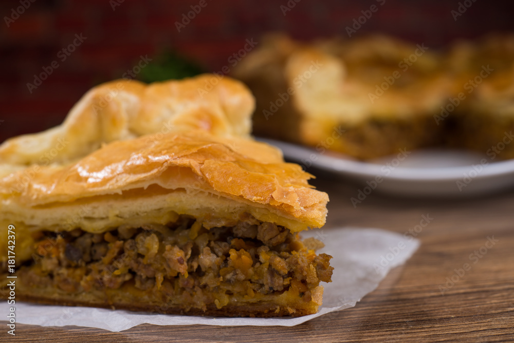 Sliced succulent meat pie with mushrooms and meat Sliced succulent meat pie with mushrooms and meat