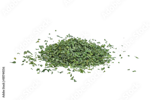 pile of dried parsley leaf or petroselinum crispum isolated on white