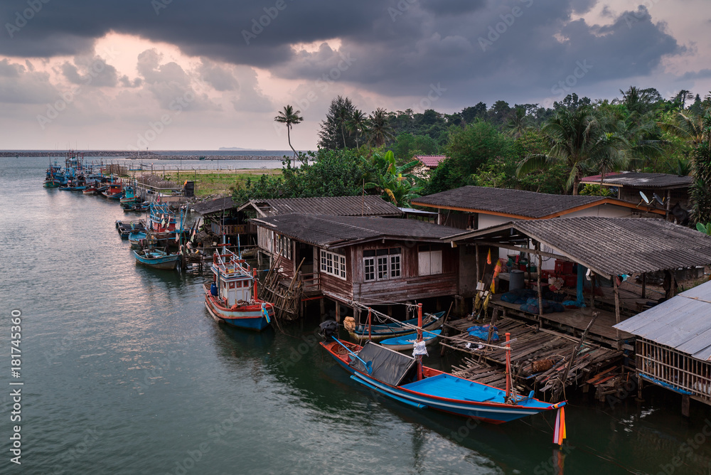 View sunset of fishing village at Thailand.