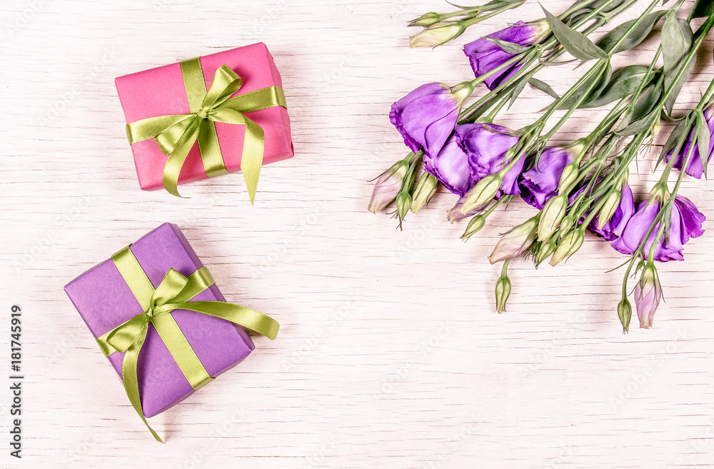 Small gift boxes and flowers. Gift on a white background. Copy space