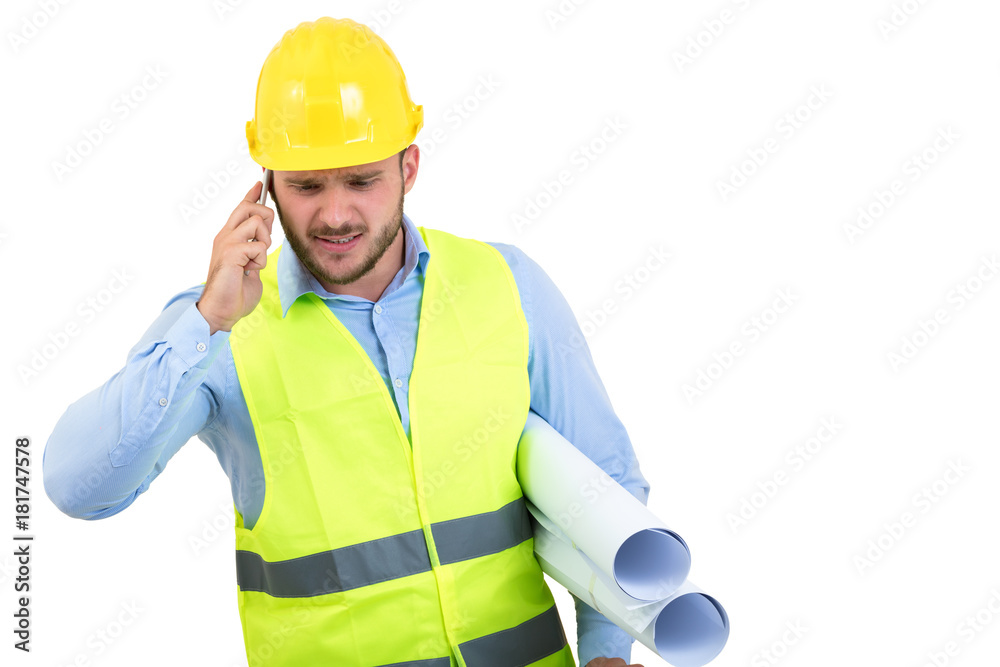 Angry upset young construction engineer yeling at the phone Angry upset young construction engineer yeling at the phone