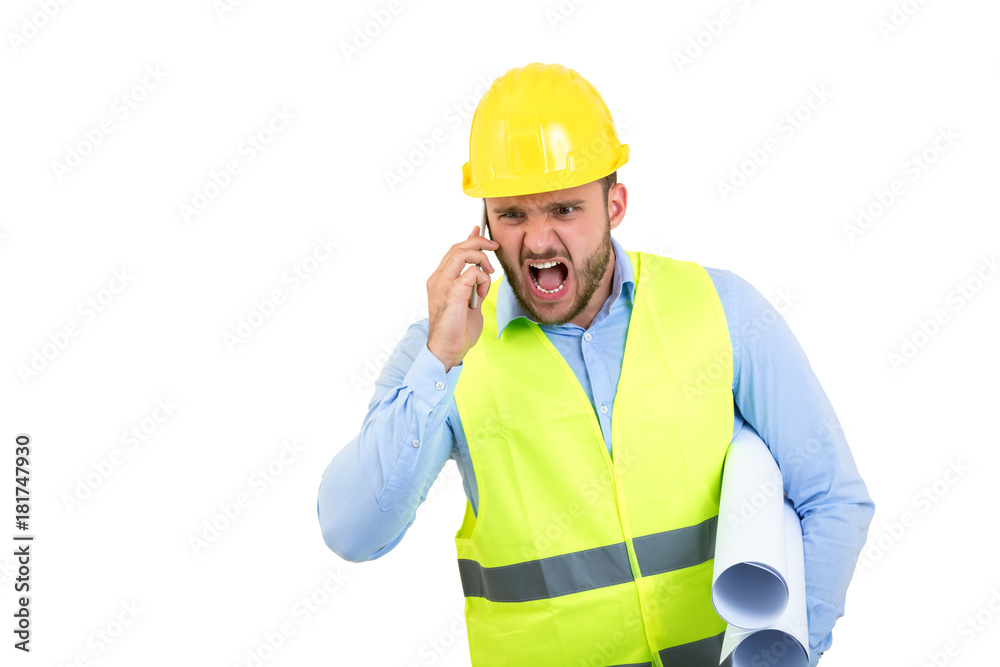 Angry upset young construction engineer yeling at the phone Angry upset young construction engineer yeling at the phone