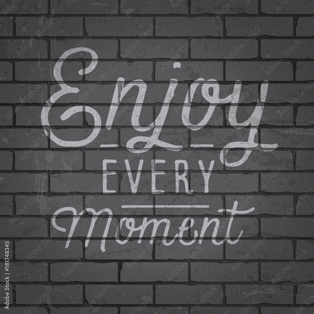 Hand drawn lettering slogan on brick wall background