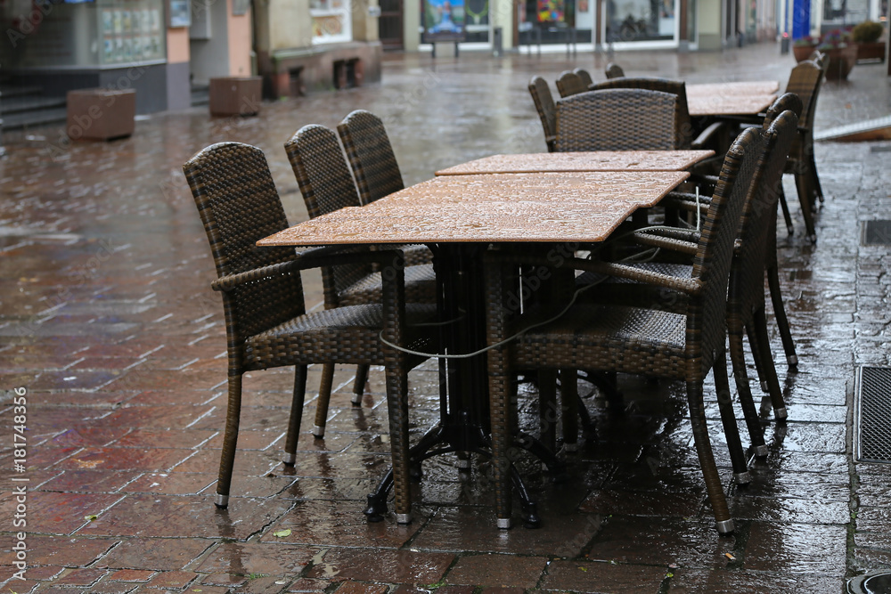 Rainy Day / Table with chairs on the street