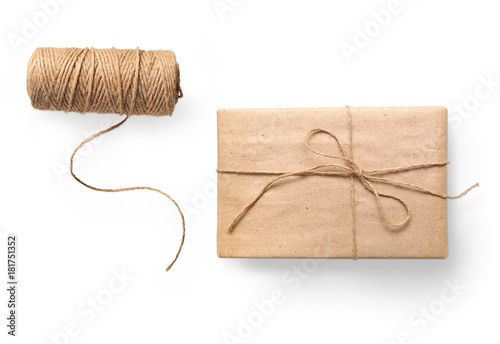 Фотография parcel wrapped packaged box gift and rope isolated on white background
