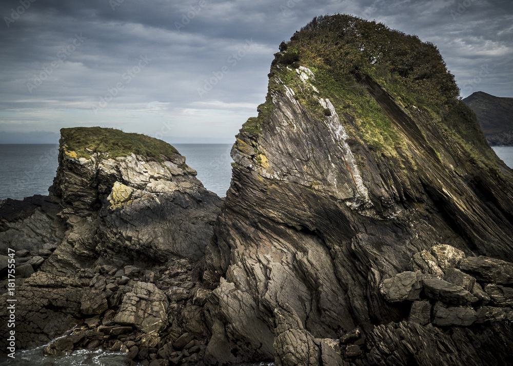 Large cliffs on a coastline with surf and waves in the background, England Large cliffs on a coastline with surf and waves in the background, England