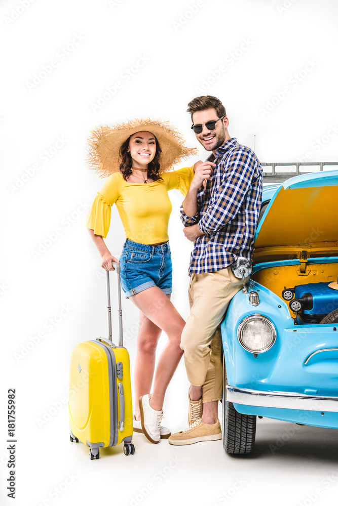 © LIGHTFIELD STUDIOS - travelers with luggage standing by car