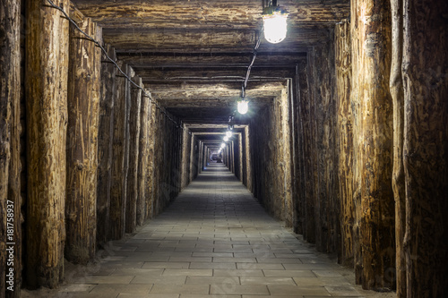 Illuminated underground tunnel in old mine
