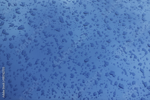 Drops on a metal surface. Abstract background.