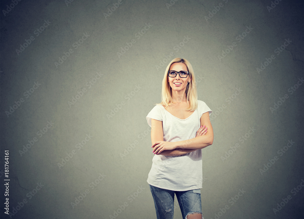Portrait of happy woman thinking looking up while standing near a concrete wall. Portrait of happy woman thinking looking up while standing near a concrete wall.
