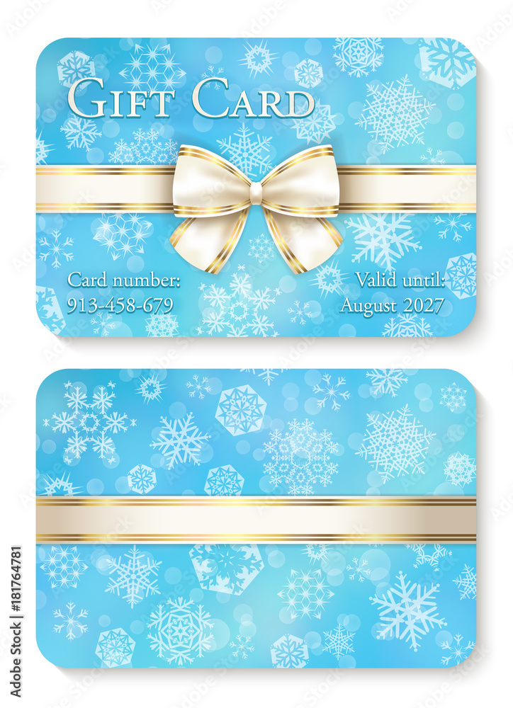 Luxury baby blue Christmas gift card with white snowflakes in background and cream ribbon as decoration - obrazy, fototapety, plakaty 