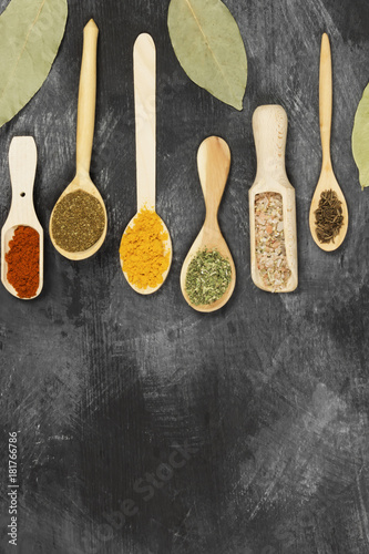 Various spices on a black background. Top view, copy space. Food background