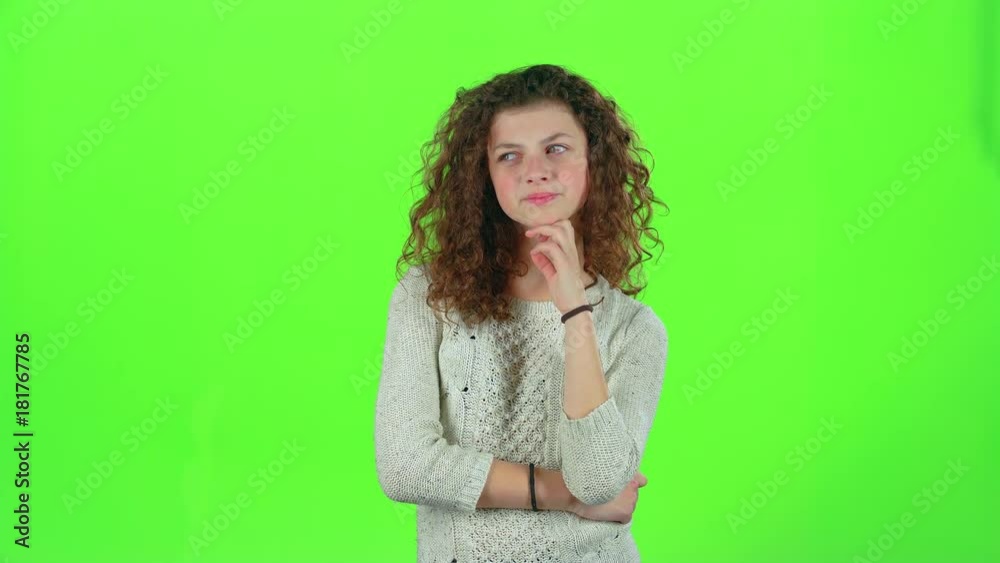 Teenage thinks and she comes up with an idea. Green screen Teenage thinks and she comes up with an idea. Green screen