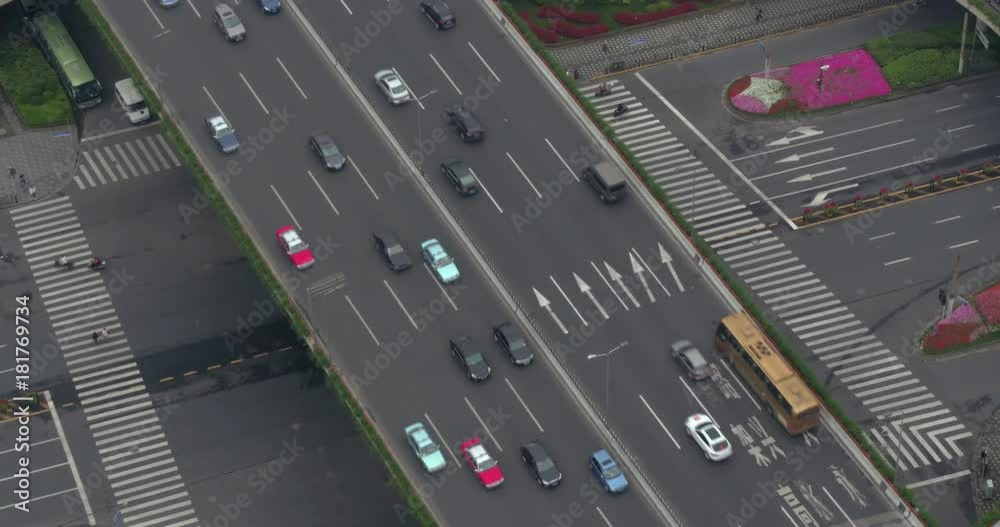 SHANGHAI, CHINA – JUNE 2016 : Aerial shot in Central Shanghai over highway traffic SHANGHAI, CHINA – JUNE 2016 : Aerial shot in Central Shanghai over highway traffic