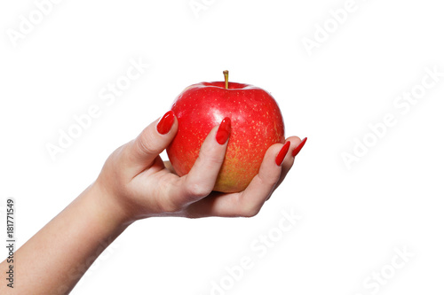 Woman hands with red nails holding apple isolated photo
