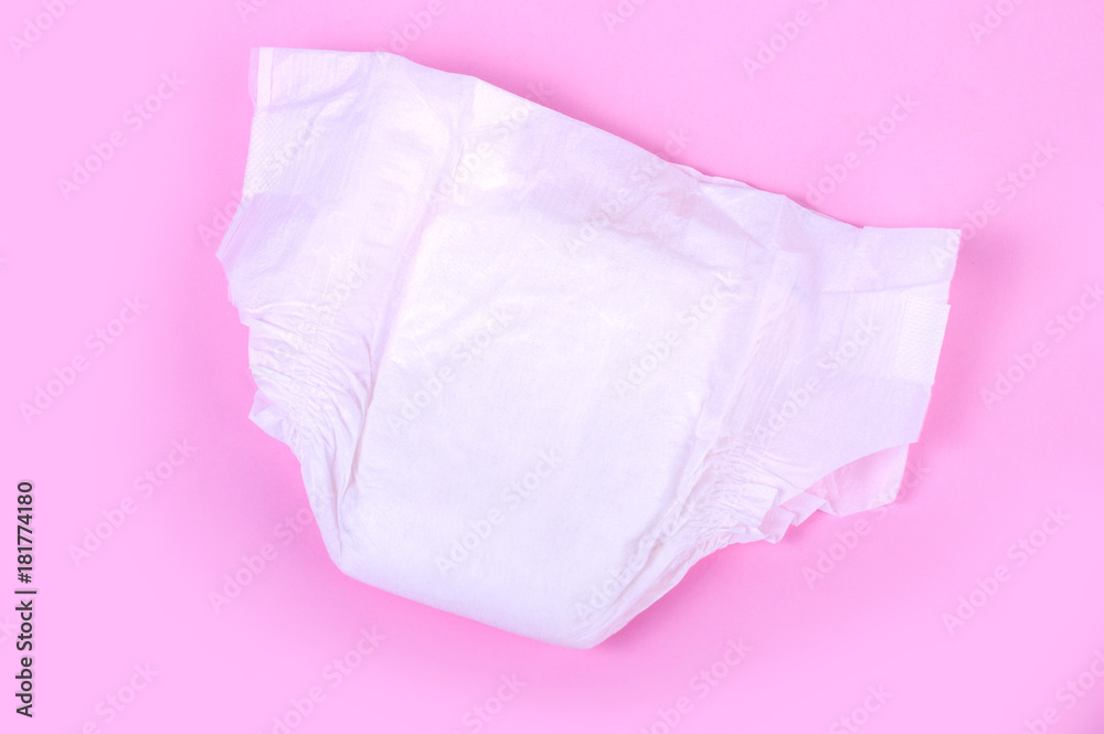 Fototapeta premium diapers for children on a pink background