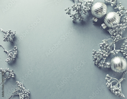 Fototapeta Naklejka Na Ścianę i Meble -  Silver Christmas Decorations on Gray Background; flat lay arrangement