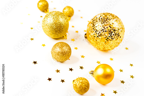 Christmas composition. a pattern of golden christmas balls and stars from above. Flat lay, top view