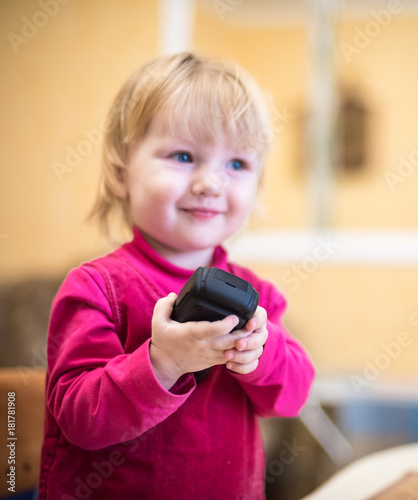 mobile phone in the hands of little girls