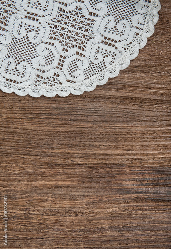 Vintage background with lace on the old wood