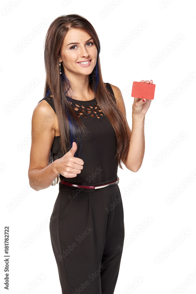Smiling elegant business woman in black standing holding blank credit card and gesturing thumb up, over white background Smiling elegant business woman in black standing holding blank credit card and gesturing thumb up, over white background
