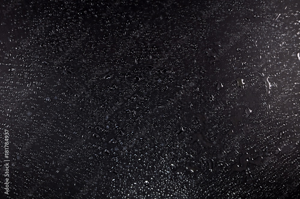 Black wet glass surface for texture or background.