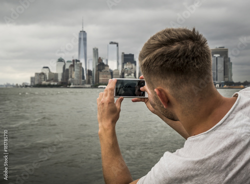 tourist photograph the New York City skyline