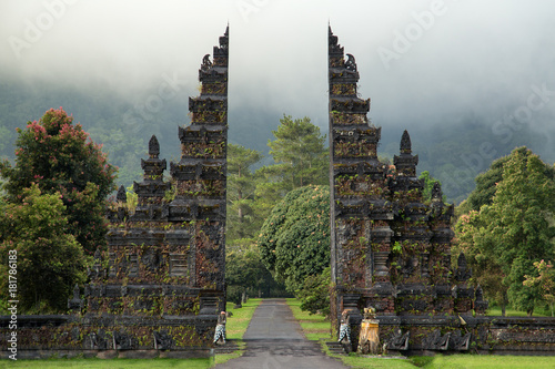 Traditional big gate entrance to temple. Bali Hindu temple. Bali island, Indonesia photo