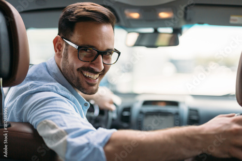 Portrait of a businessman driving car