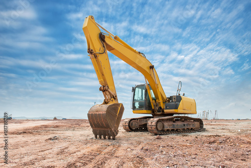 Heavy earth mover with blue sky in the background photo