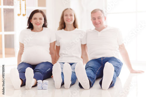 Portrait of family expecting new baby to come