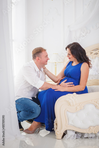 pregnant woman and a man hugging with love