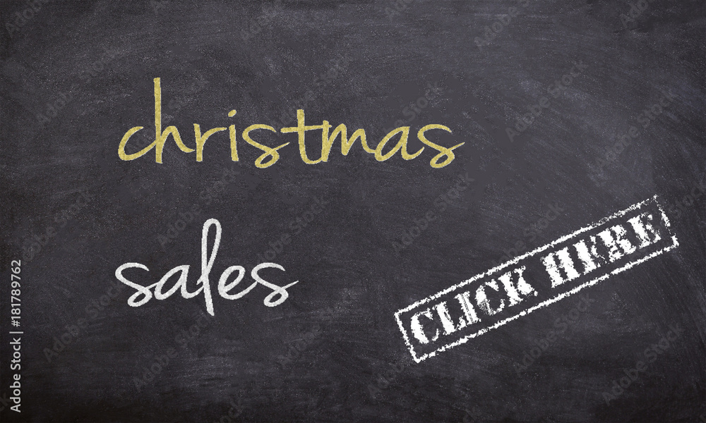 Fototapeta premium christmass sales chalk handwritten text on a black board with stars illustration and click here rubber stamp