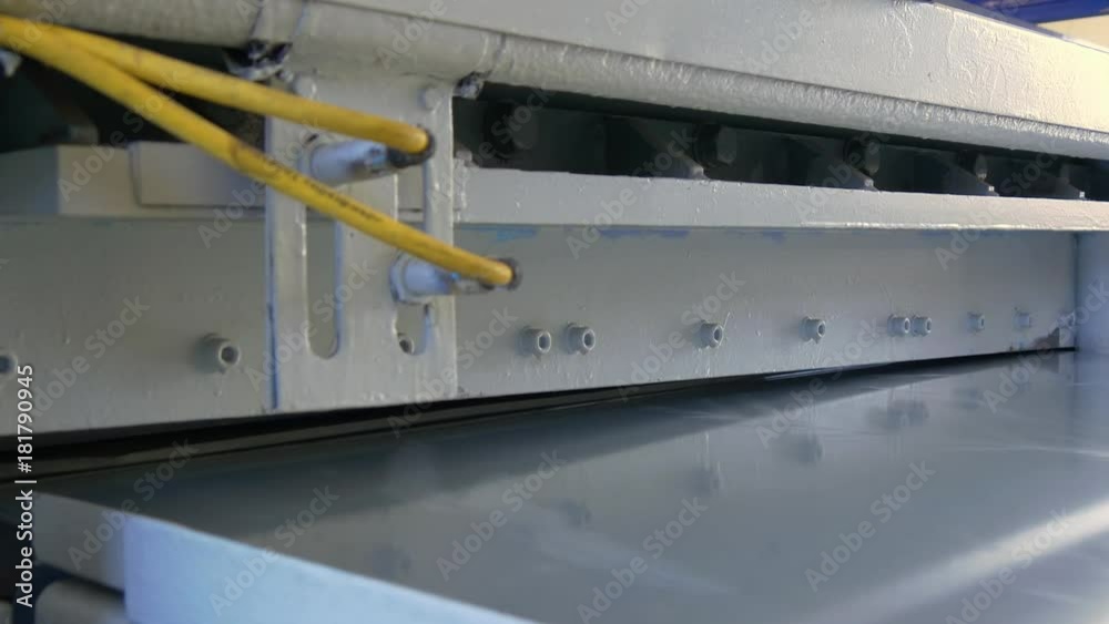 Bending of metal tubes on industrial machine in factory. Manufacture of refrigeration and ventilation equipment and air conditioners. Modern technologies. Bending of metal tubes on industrial machine in factory. Manufacture of refrigeration and ventilation equipment and air conditioners. Modern technologies.