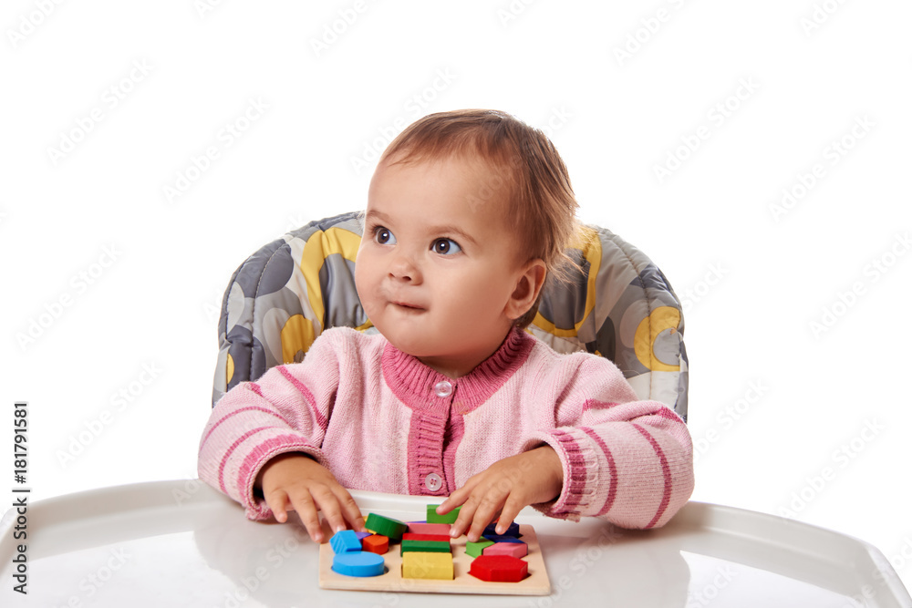Child little girl learning to use colorful logic game isolated on white background Child little girl learning to use colorful logic game isolated on white background