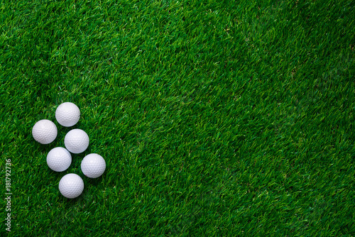 Golf balls on green grass in golf course
