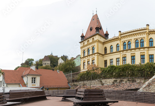 Fragment of the palace adjoining the clock tower in old city of Sighisoara in Romania