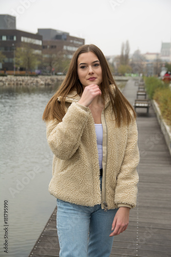 Young girl with winter coat in city
