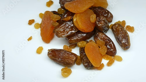 4k, Dried fruits rotate on a white background. dried apricots, raisins, Date Fruits photo