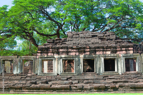 phimai Historical and ancient stone castle in thailand and big tree © iammotos