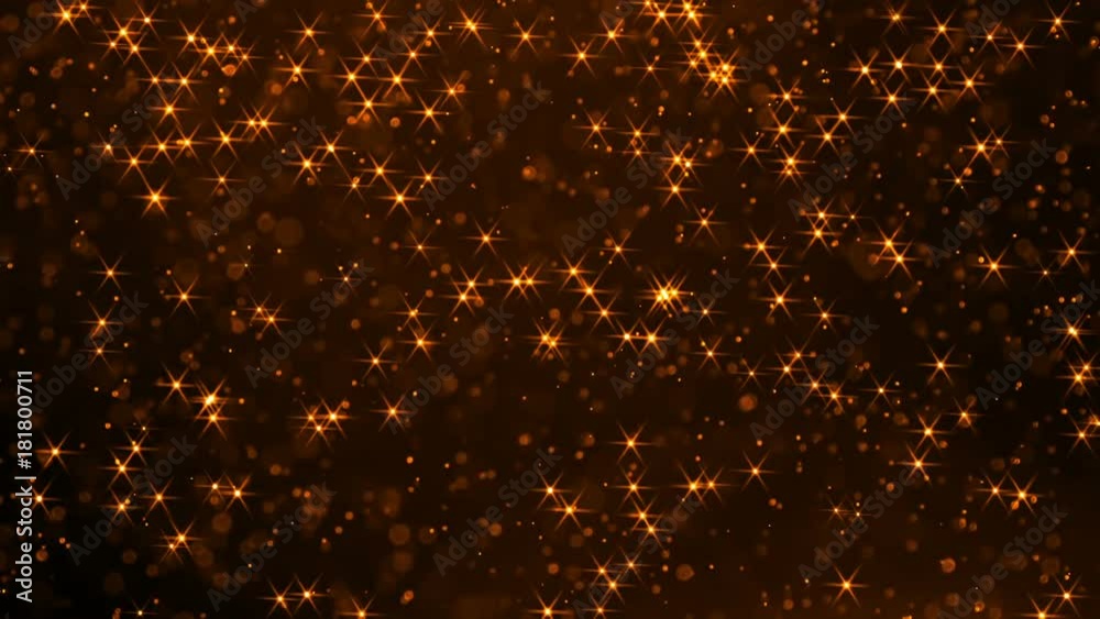 Flight of the Brilliant Golden Dust. Small sparkling colored particles slowly and chaotically soar in the air creating an atmosphere of magic. Slow Motion at a rate of 240 fps