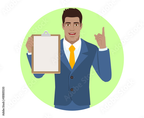 Businessman holding the clipboard and pointing up