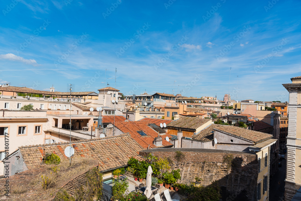 Old roofs under a sunny sky in Rome