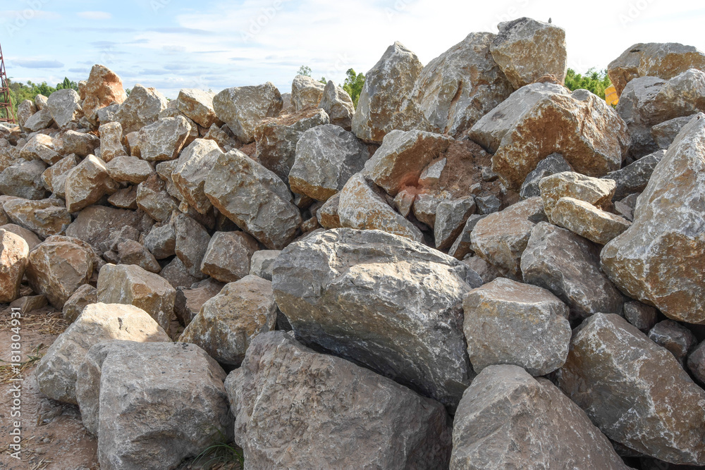 Big stone pile outdoors. For the construction of structures that require high stability.
