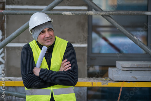 Fotografie Engineer with protective workwear freezing outdoors