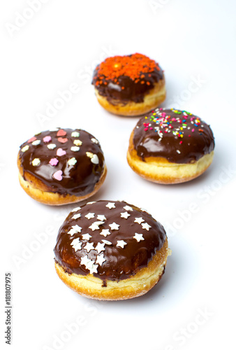 Decorated chocolate donuts on white background